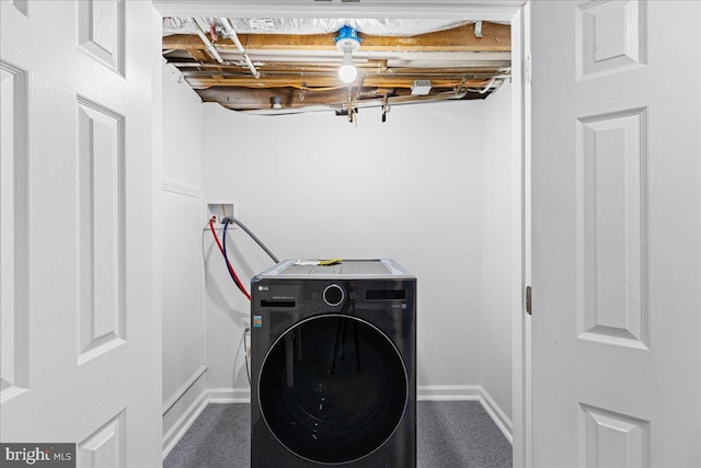 laundry room with washer / dryer