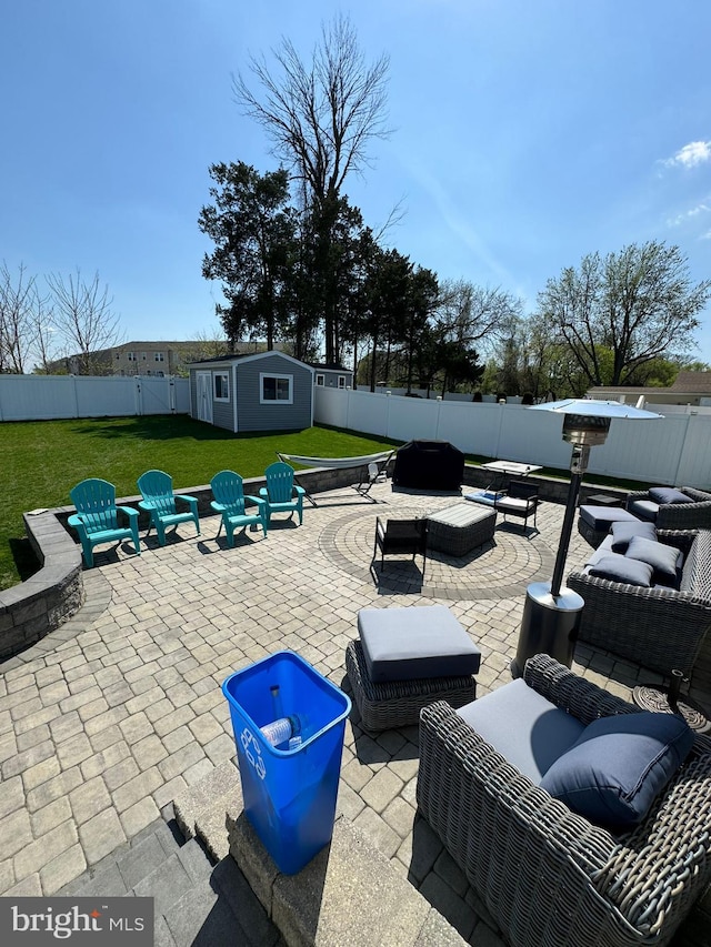 view of patio / terrace featuring an outdoor hangout area and an outbuilding