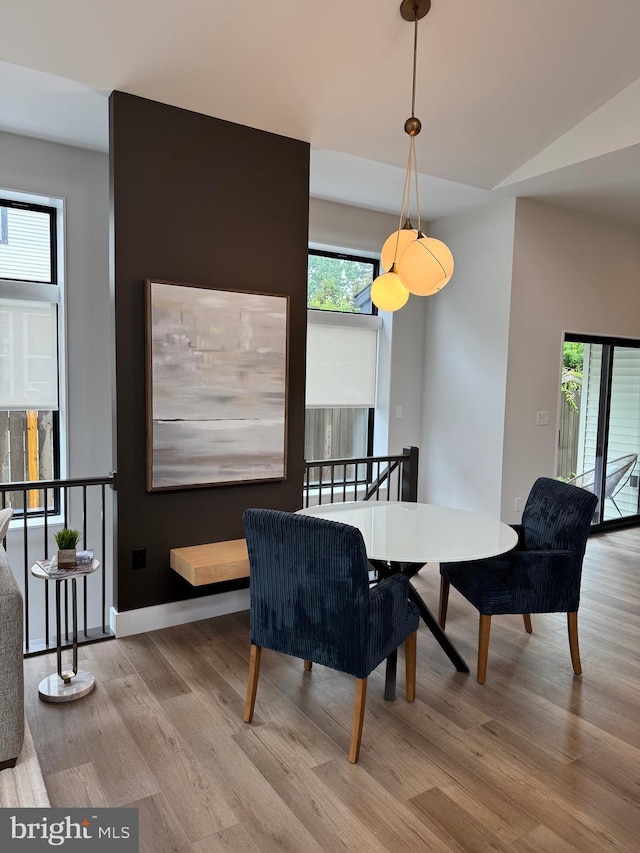 256 S Cedar St, Lititz, PA 17543 - dining room with wood finished floors, vaulted ceiling, and baseboards