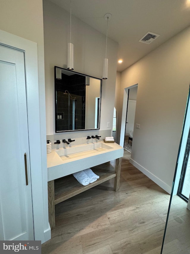 256 S Cedar St, Lititz, PA 17543 - bathroom with vanity, wood finished floors, recessed lighting, baseboards, and a shower