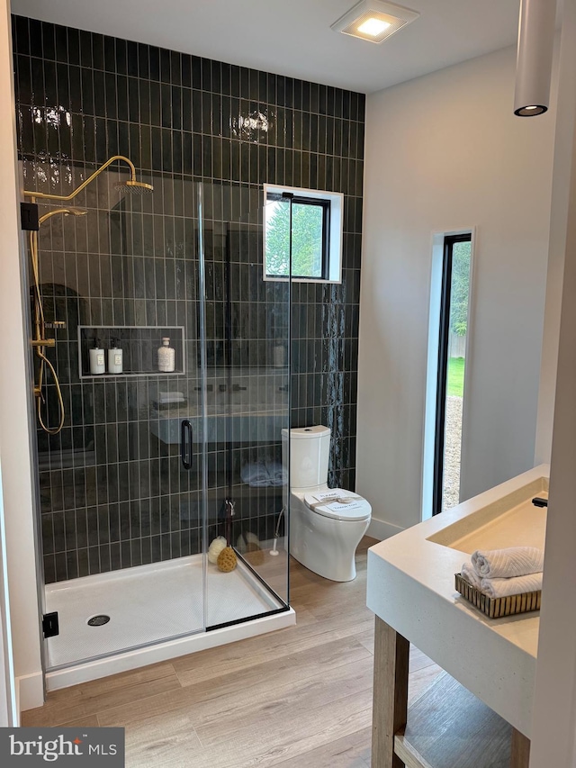256 S Cedar St, Lititz, PA 17543 - full bathroom with toilet, wood finished floors, and a stall shower