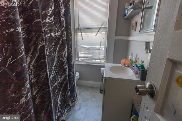 bathroom with vanity and toilet