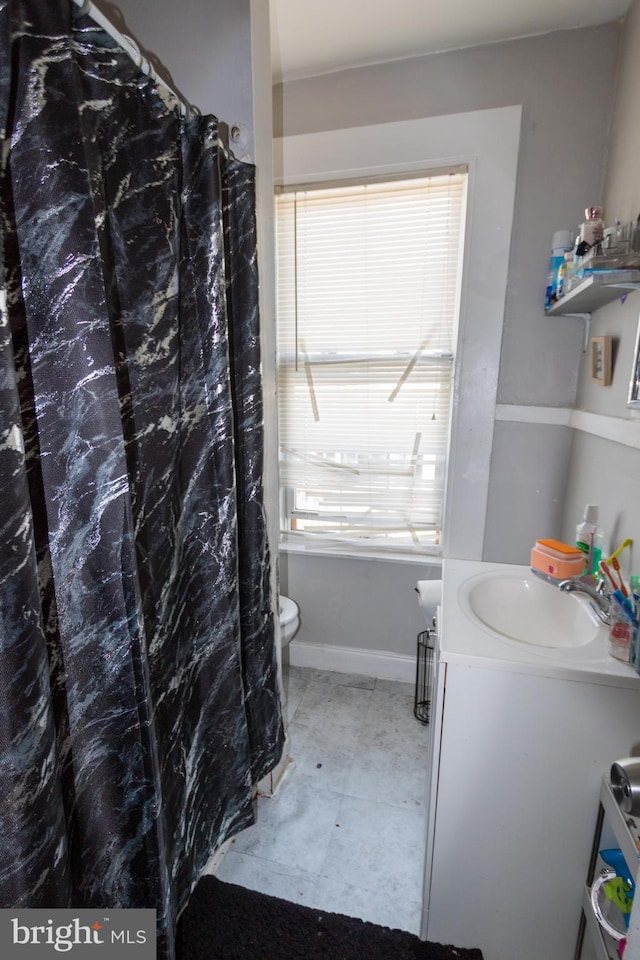 bathroom featuring vanity and toilet