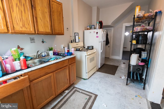 kitchen featuring white appliances and sink