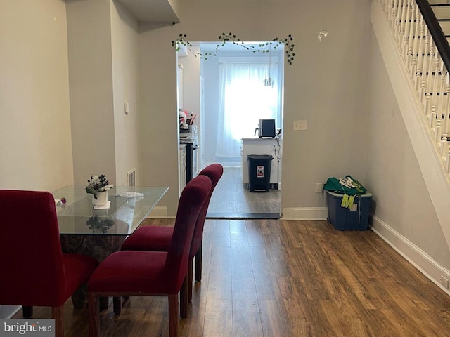 dining space featuring hardwood / wood-style flooring