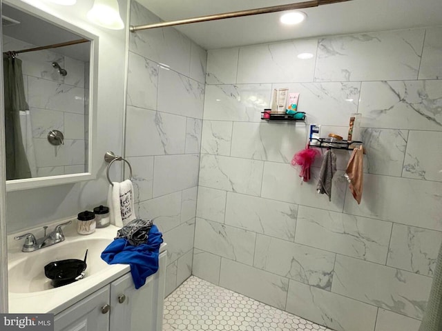 bathroom featuring vanity and a shower with shower curtain