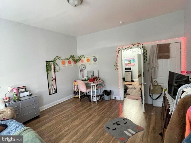 bedroom featuring dark wood-type flooring