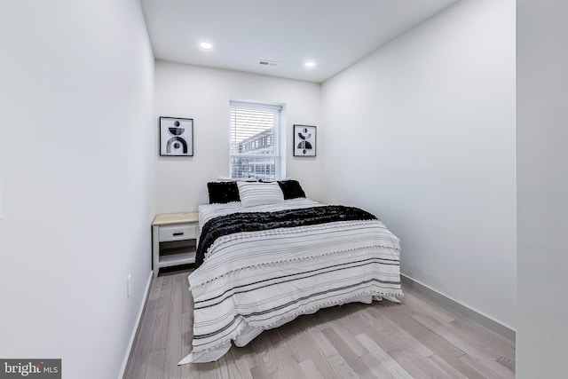 bedroom with light hardwood / wood-style floors