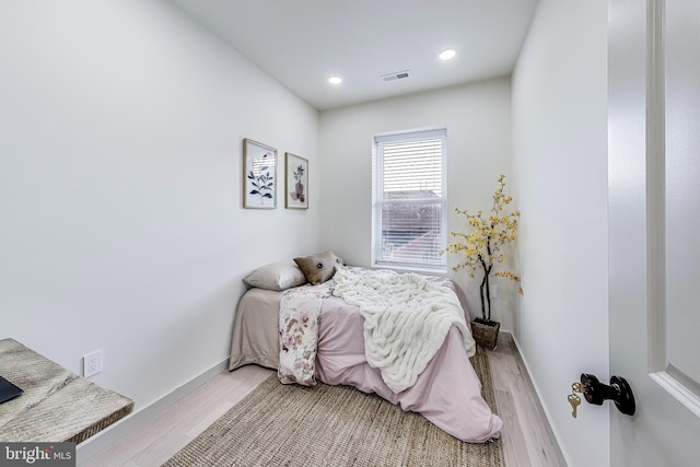 bedroom with light wood-type flooring