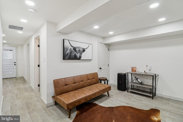 sitting room featuring light hardwood / wood-style floors