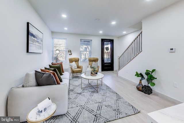 living room with light hardwood / wood-style flooring