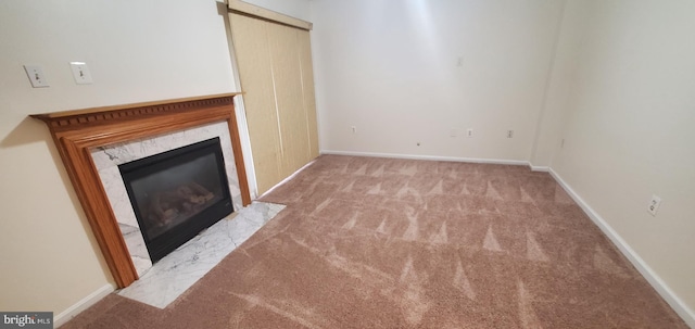 unfurnished living room with light carpet