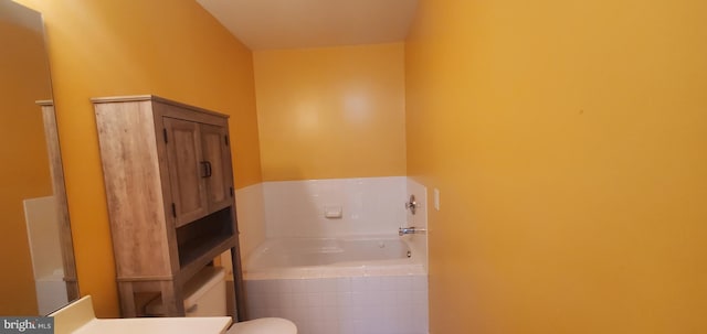 bathroom with tiled bath