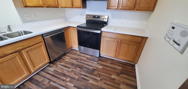 kitchen with sink, dark hardwood / wood-style floors, and appliances with stainless steel finishes