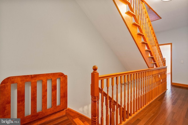 staircase with wood-type flooring