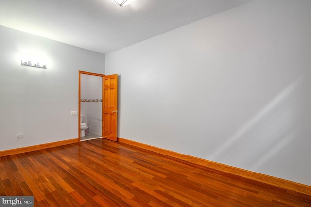 unfurnished room featuring wood-type flooring