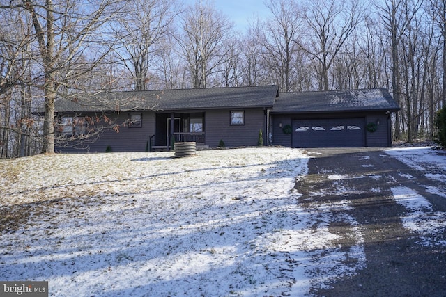 ranch-style home featuring a garage