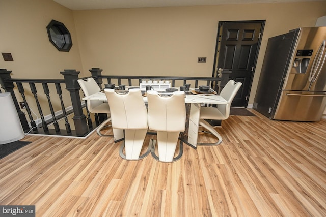 dining room with light wood-type flooring