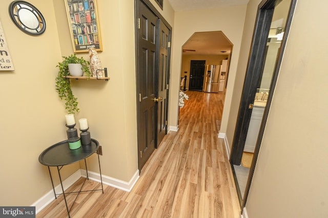 corridor featuring light wood-type flooring