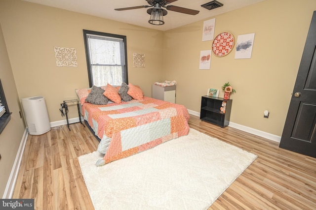 bedroom with ceiling fan and light hardwood / wood-style flooring