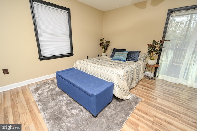 bedroom with hardwood / wood-style flooring