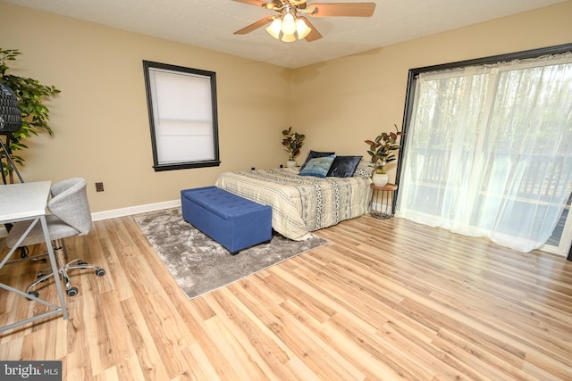 bedroom with ceiling fan and light wood-type flooring