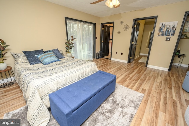 bedroom with hardwood / wood-style flooring and ceiling fan