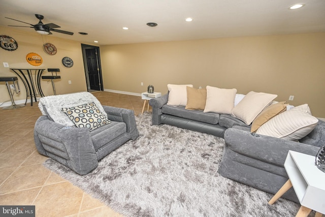 living room with tile patterned floors and ceiling fan