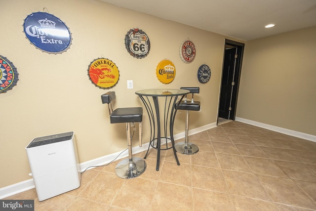 dining space featuring tile patterned flooring