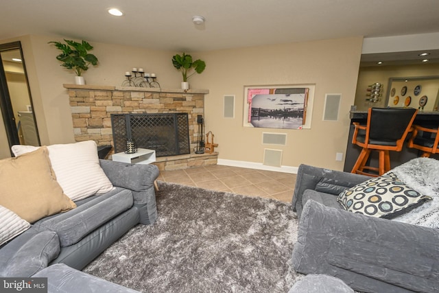 tiled living room with a fireplace