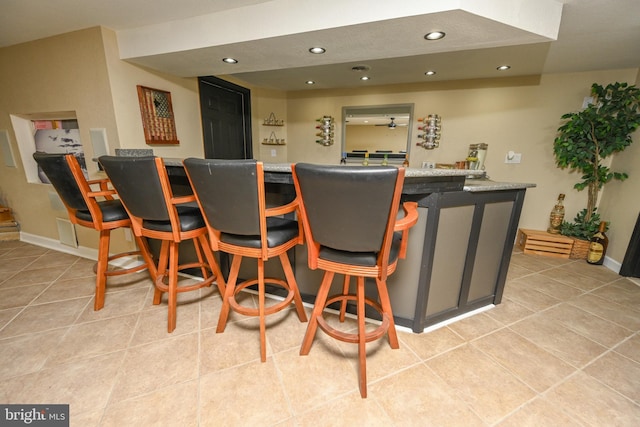 bar with light tile patterned floors