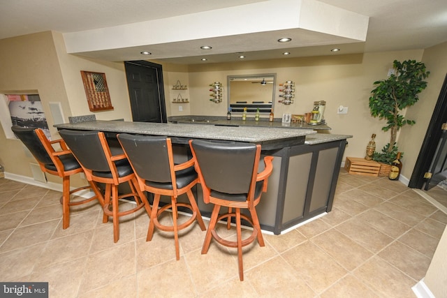 bar featuring light tile patterned flooring