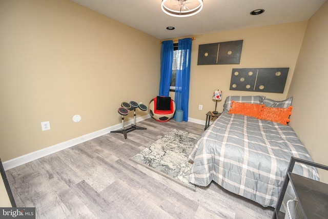 bedroom with wood-type flooring