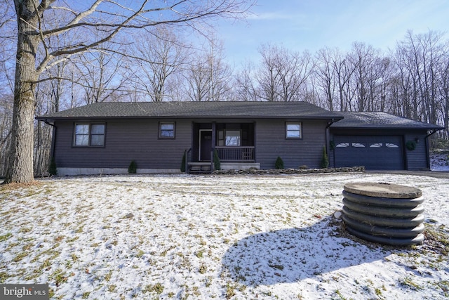 view of front of property with a porch and a garage