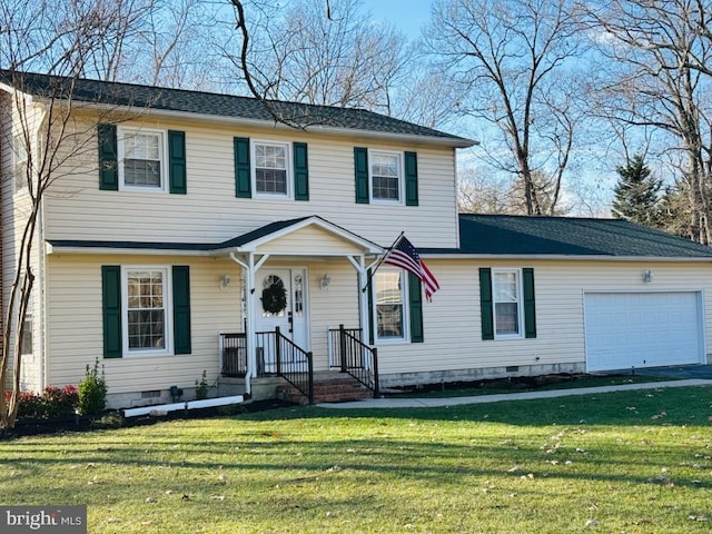 view of front of property with a garage and a front lawn