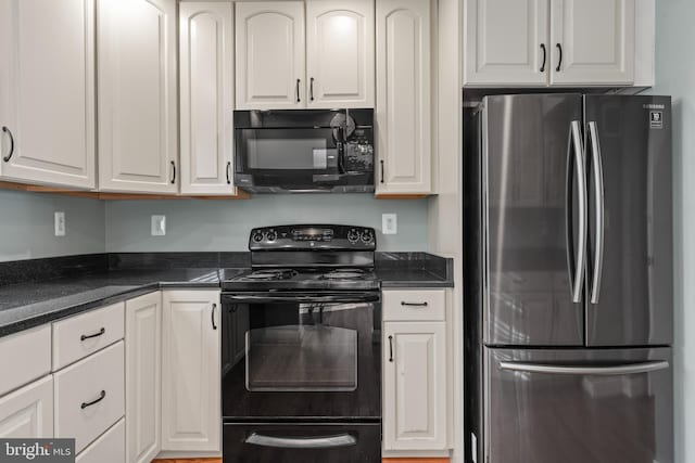 kitchen featuring black appliances and white cabinetry