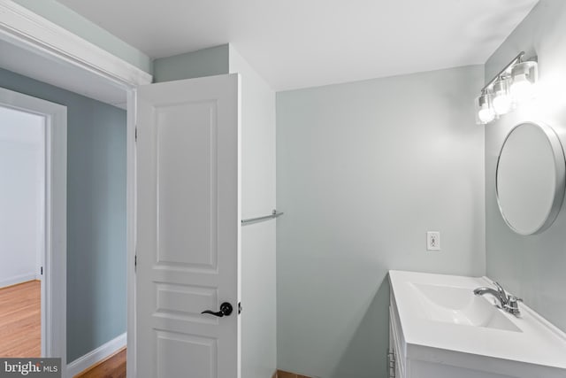 bathroom featuring wood-type flooring and vanity