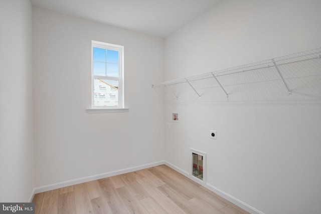 laundry area featuring hookup for an electric dryer, washer hookup, and light wood-type flooring