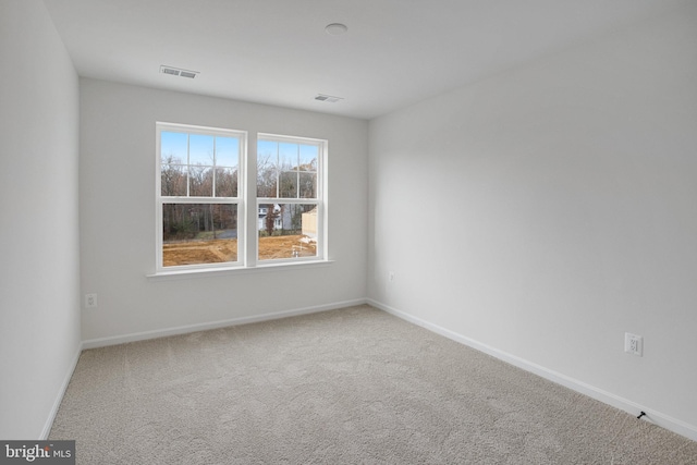 unfurnished room with carpet floors