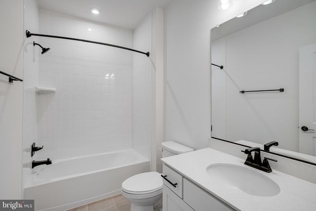 full bathroom with toilet, vanity, tiled shower / bath combo, and tile patterned floors