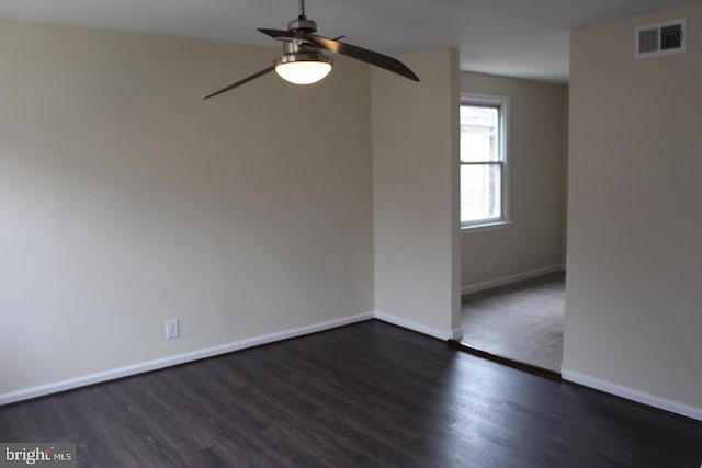 unfurnished room featuring ceiling fan and dark hardwood / wood-style floors