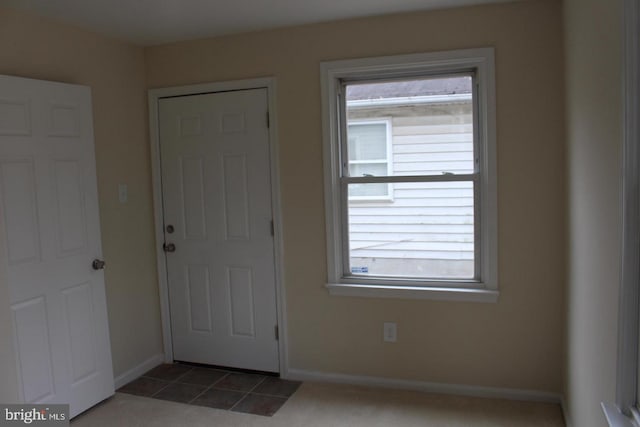 entryway with light tile patterned floors