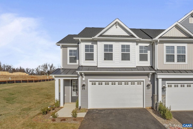 view of front of property with a garage and a front lawn