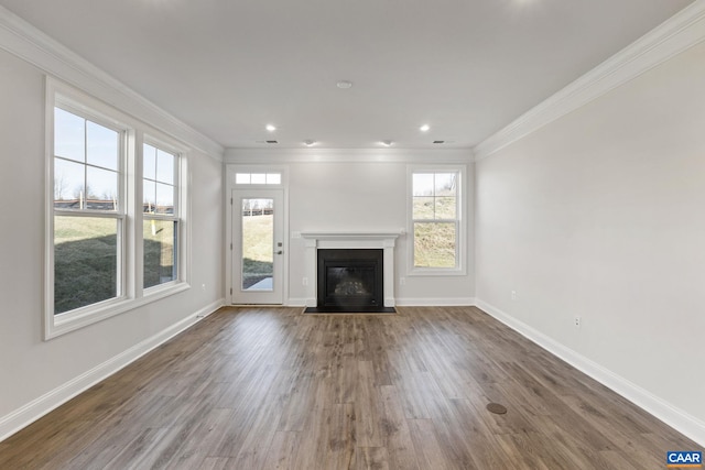 unfurnished living room with crown molding and dark wood-type flooring