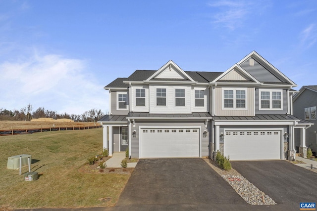 view of front facade featuring a garage and a front lawn