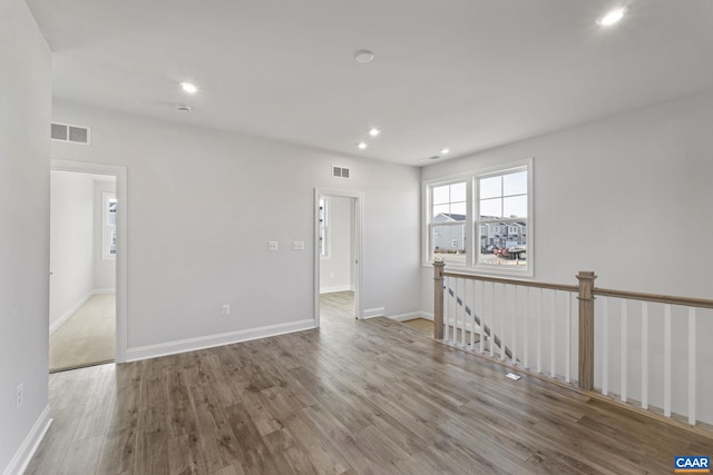 unfurnished room with light hardwood / wood-style flooring