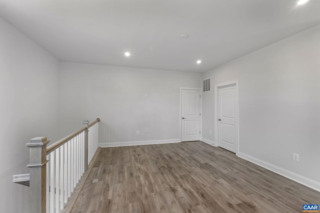 empty room featuring hardwood / wood-style flooring