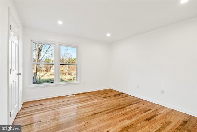 empty room with light wood-type flooring