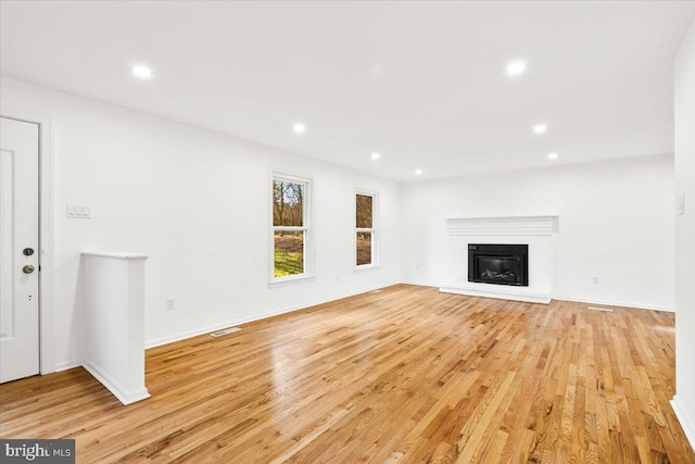 unfurnished living room featuring light hardwood / wood-style floors