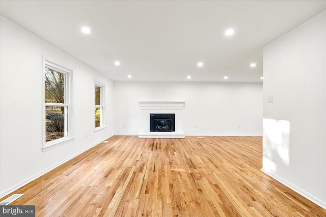 unfurnished living room featuring light hardwood / wood-style floors